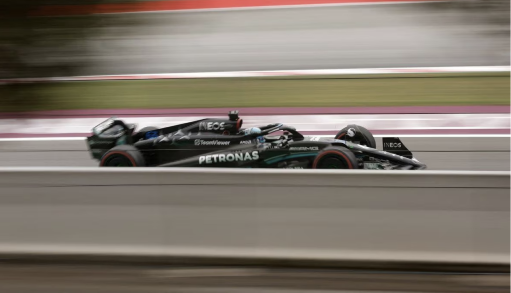 Race car driver mistakes sweat for rain.